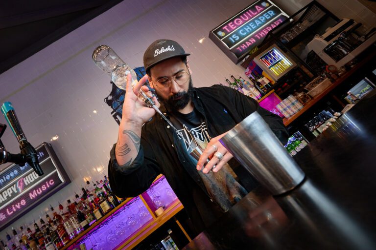 Barman pouring shot