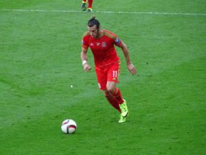 Gareth Bale dribbles with the ball for Wales.