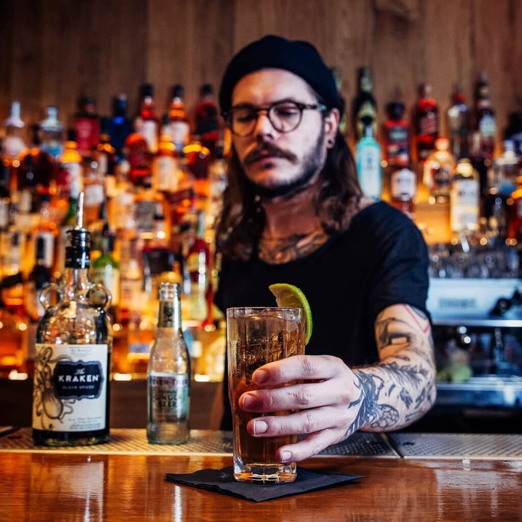 A bartender serves a drink in Belushi's Bar in Amsterdam.