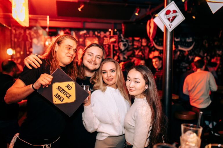 A group of friends partying in Belushi's Bar in Amsterdam.