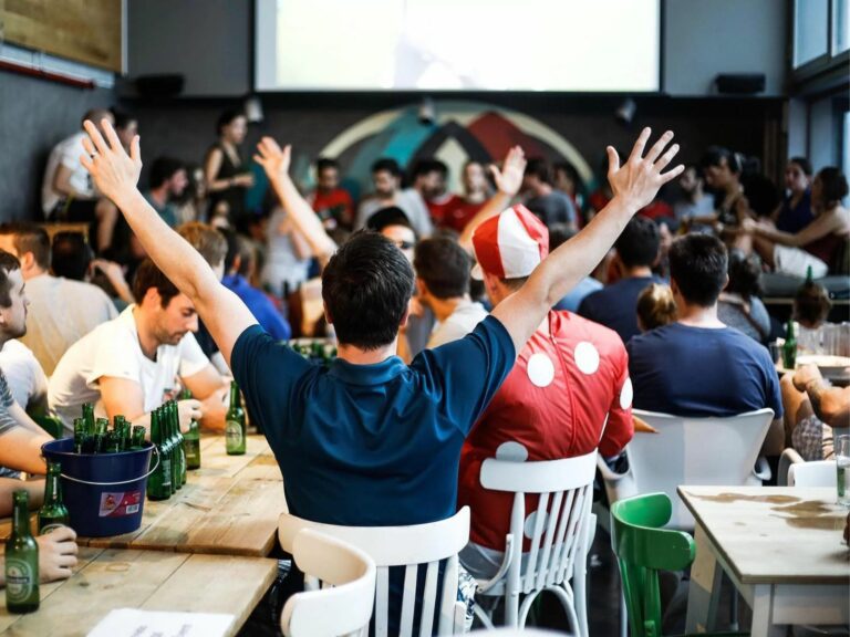 Football fans watching in a bar