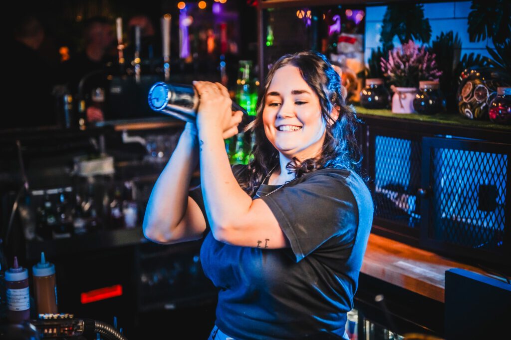 A bartender shakes a Margarita at a Belushi's Bar.