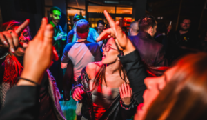 young women dancing at a bar