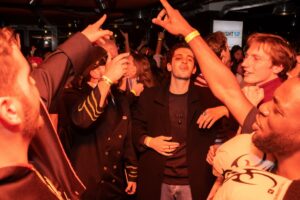 A picture of a group of people dancing at a Belushi's bar