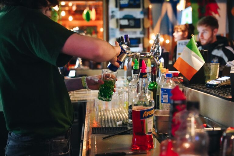 An image of a Belushi's bartender making cocktails from behind the bar