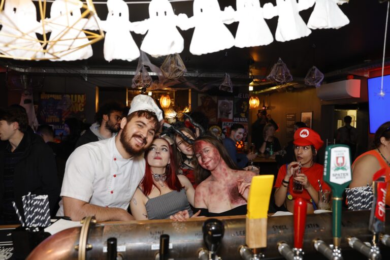 A group of customers dressed up for Halloween at a Belushi's bar