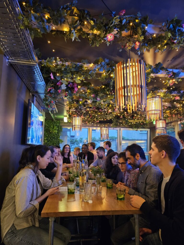 A group of customers enjoyng cocktails at a Belushi's bar