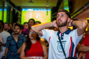 England football fan watching a game in anticipaton at a Belushi's bar