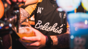 A Belushi's bartender pouring a pint