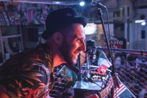 An image of a live musician at a Belushi's bar