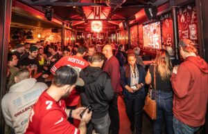 An image of customers gathering indoor at a Belusi's