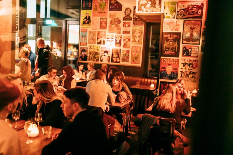 An image of Belushi's main seating area with customers seated, eating and drinking