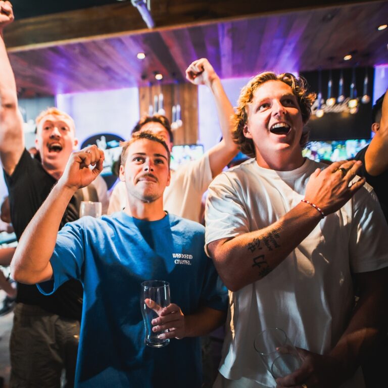 A picture of men celebrating a goal at a Belushi's bar