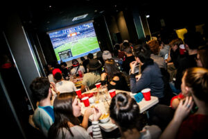 An interior view of Belushi's bar in Greenwich with guests.